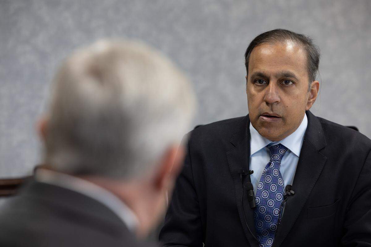 U.S. Rep. Raja Krishnamoorthi speaks to Touchette Regional Hospital CEO Larry McCulley during a visit to the Cahokia Heights hospital.