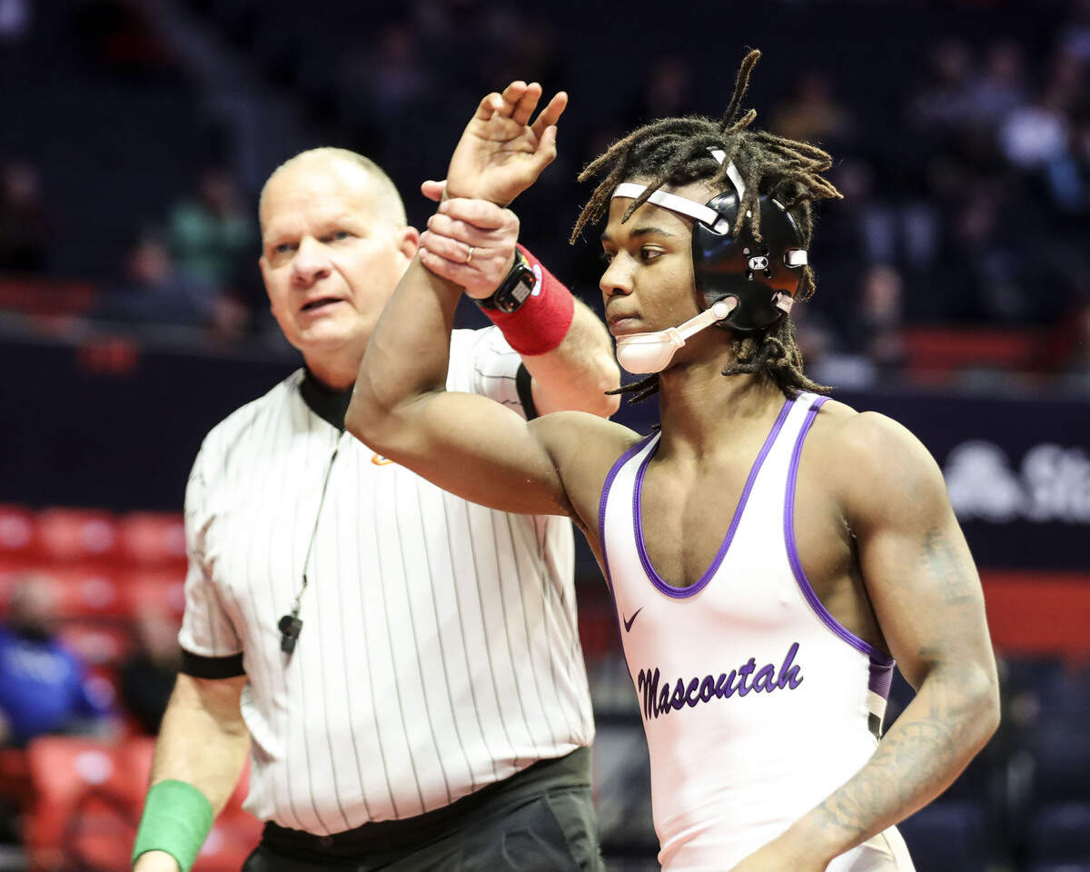 Mascoutah’s Santino Robinson has his hand raise after winning his preliminary match at the 2023 IHSA Individual Wrestling State Finals on Thursday in Champaign.