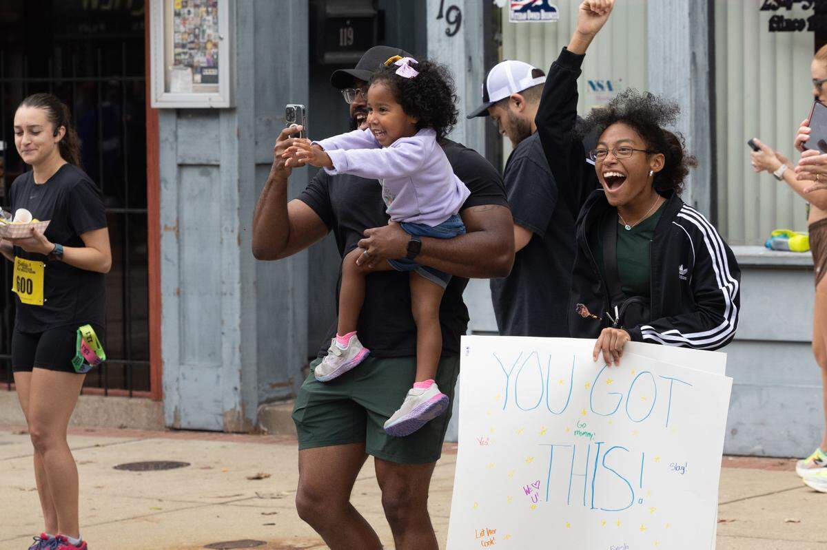 Families lined Belleville’s Main Street during the Belleville Marathon on Sept. 28, 2024, with especially vigorous cheering for loved ones who crossed the finish line.