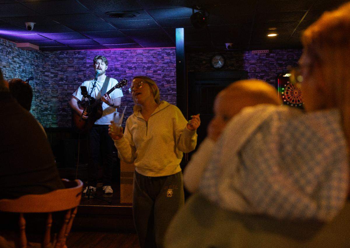 Edwin Linson performs to a multigenerational crowd Saturday, March 15, 2205 at Tres Hombres in Carbondale, Illinois. (Julia Rendleman for ProPublica)