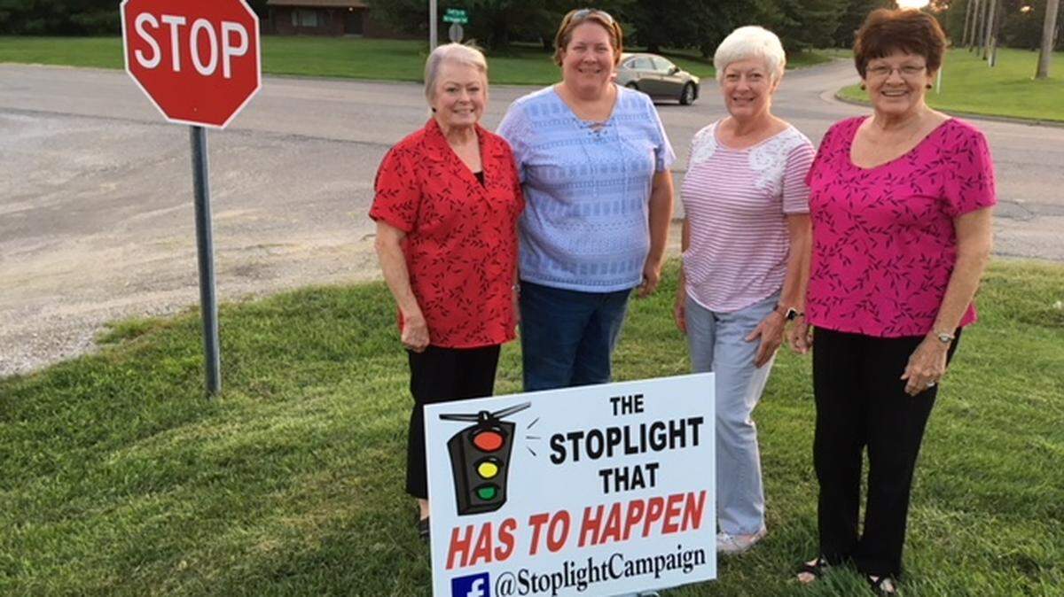 Debbie LaFreniere, Julie Spengler, Millie Erb and Sandy Hildebrandt are going door-to-door to rally support for their traffic light.