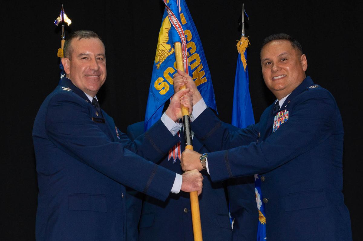 U.S. Air Force Col. Edward Hogan, 635th Supply Chain Operations Group incoming commander, assumes command after receiving the guidon from Col. Ryan Bakazan, 635th Supply Chain Operations Wing commander, on Scott Air Force Base. Hogan is a logistics officer and received his commission as a Distinguished Graduate of Officer Training School at Maxwell Air Force Base, Alabama.