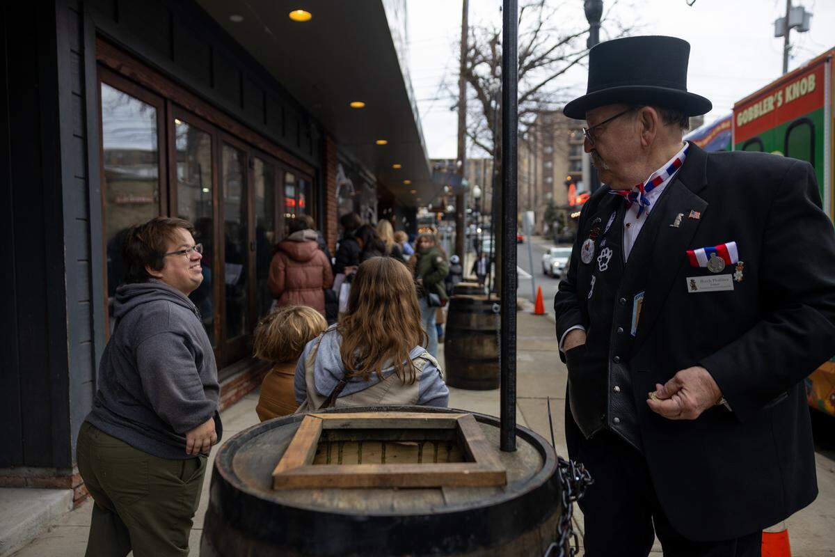 Butch “Iceman” Philliber greets guest as they wait in line to see Punxsutawney Phil on Saturday, Jan. 17, 2026 in State College.