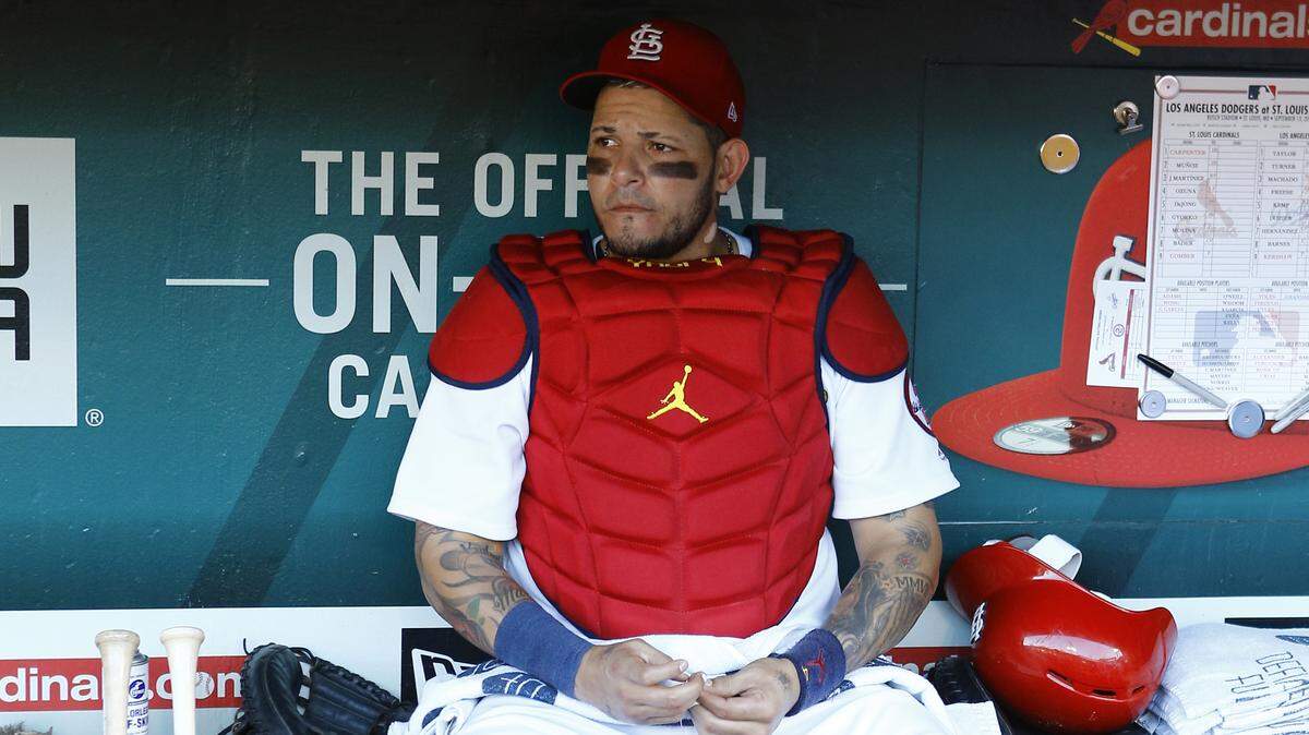 St. Louis Cardinals catcher Yadier Molina sits in the dugout prior to a baseball game against the Los Angeles Dodgers Thursday, Sept. 13, 2018, in St. Louis. (AP Photo/Billy Hurst)
