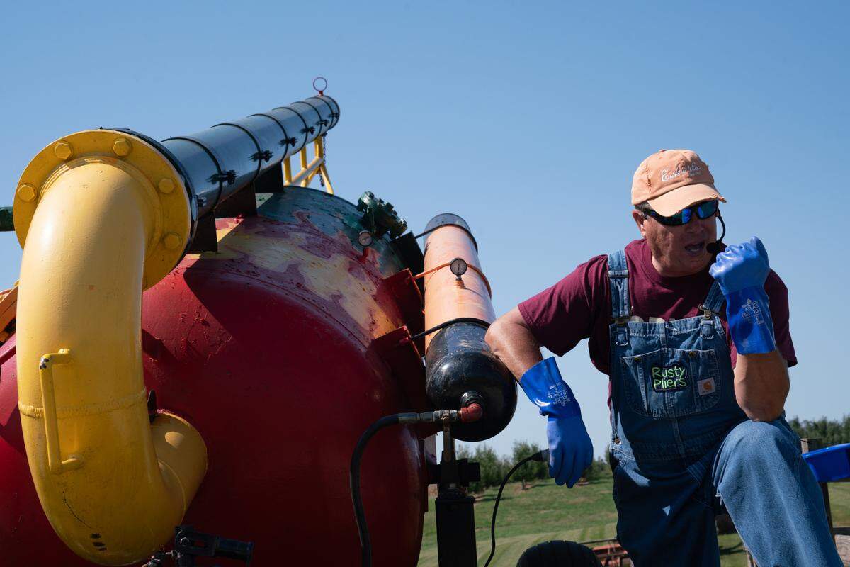 ‘Rusty Pliers’ has operated Eckert’s pneumatic pumpkin cannon for years and hosts hourly shows in which he fires pumpkins hundreds of yards with great enthusiasm at their Milstadt Fun Farm.