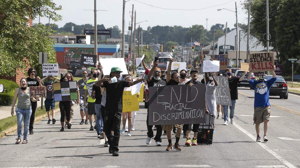 About 40 people gathered outside Empire Comfort Systems in Belleville on Friday afternoon before marching downtown in a Black Lives Matter protest planned by an employee who has accused the company of allowing racial discrimination.