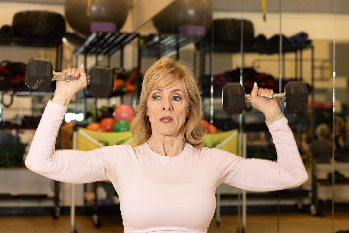 Personal trainer Denise Dill leads an aerobics class at Belleville Health and Fitness Club on Feb. 4, 2025.