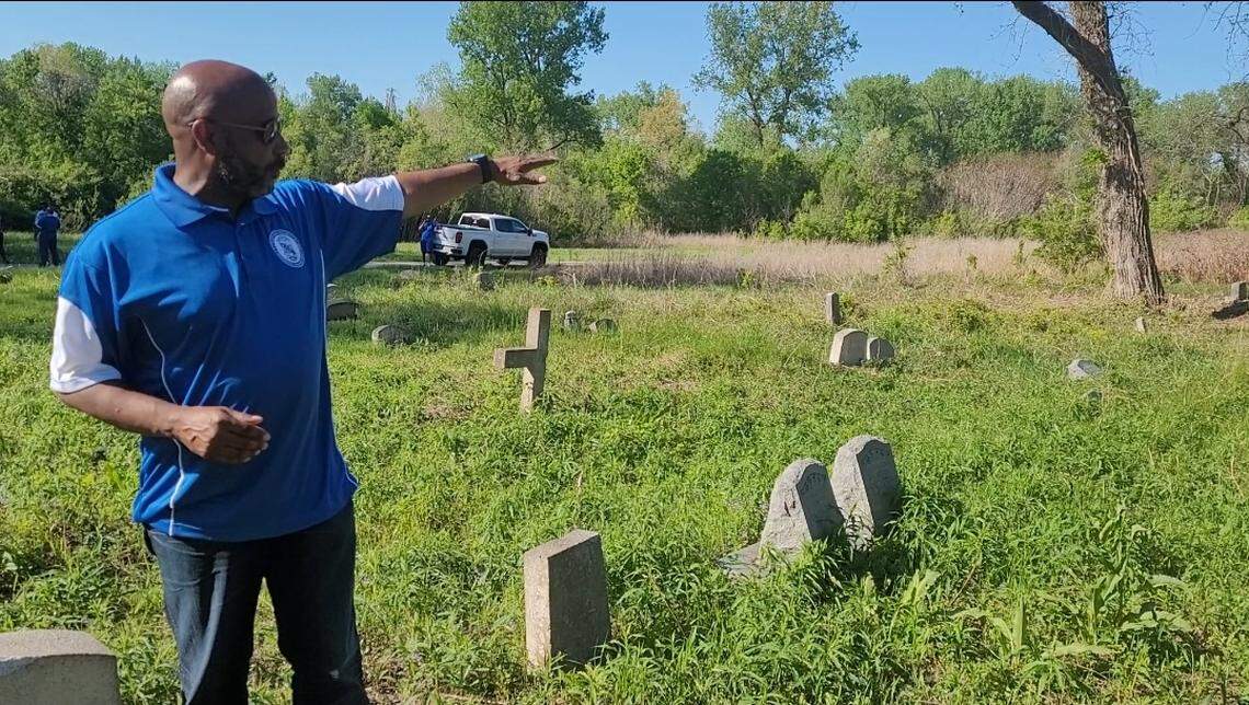 Carlos Glenn, president of the Nu Gamma Sigma Alumni Chapter of Phi Beta Sigma Fraternity, Inc. , explains his fraternity’s plans to clean Booker T. Washington Cemetery in Centreville