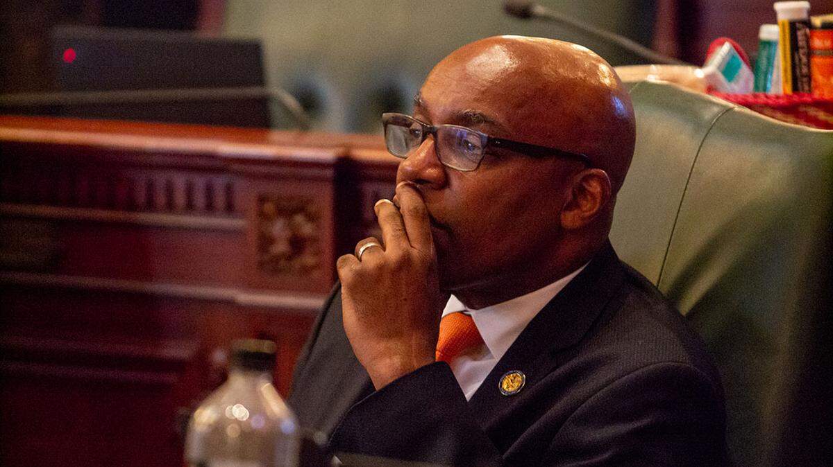 Attorney General Kwame Raoul listens to debate in the Illinois House in May 2023.