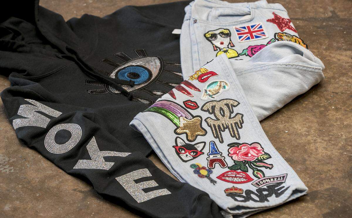 A hoodie and pants designed by Unlimitd the Poet.