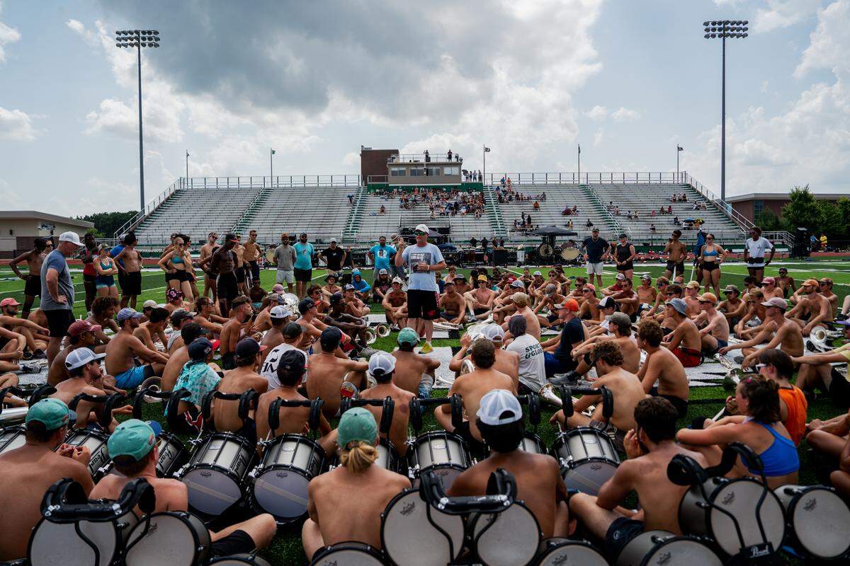 Colin McNutt, percussion caption head and renowned musician, gives Boston Crusaders members a pep talk before a rehearsal of their show BOOM on Tuesday, July 22, 2025, at Pattonville High School in Maryland Heights.
