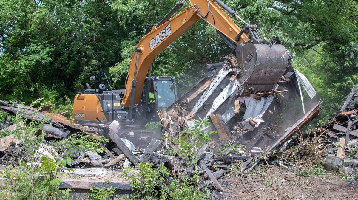 Work crews with the city of Cahokia Heights begin the process of cleaning up the remenants of 2 burned out houses off of N 82nd Street in Cahokia Heights. The work is part of Operation Fresh Start, a citywide clean-up effort to transform each neighborhood one block at a time.