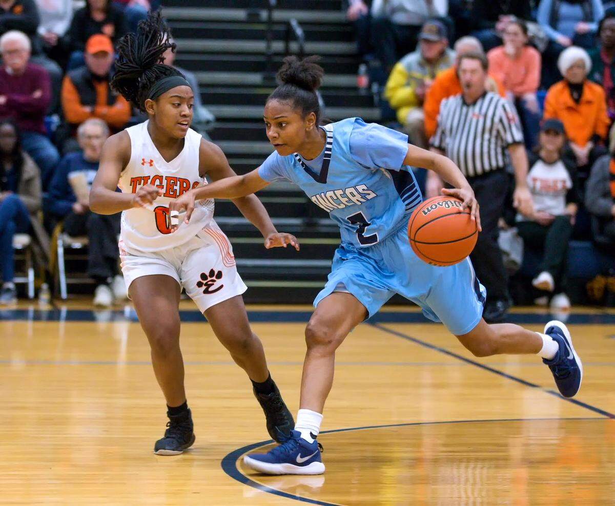 Belleville East’s Jailyn McClenny drives against Edwardsville’s Quierra Love during Friday’s Class 4A Belleville East Regional Championship game.