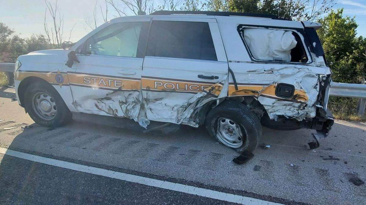 An Illinois State Police trooper was inside this vehicle when a tractor-trailer crashed into it about 6 a.m. Sunday in Fayette County. He had stopped to help a motorist along Interstate 70.