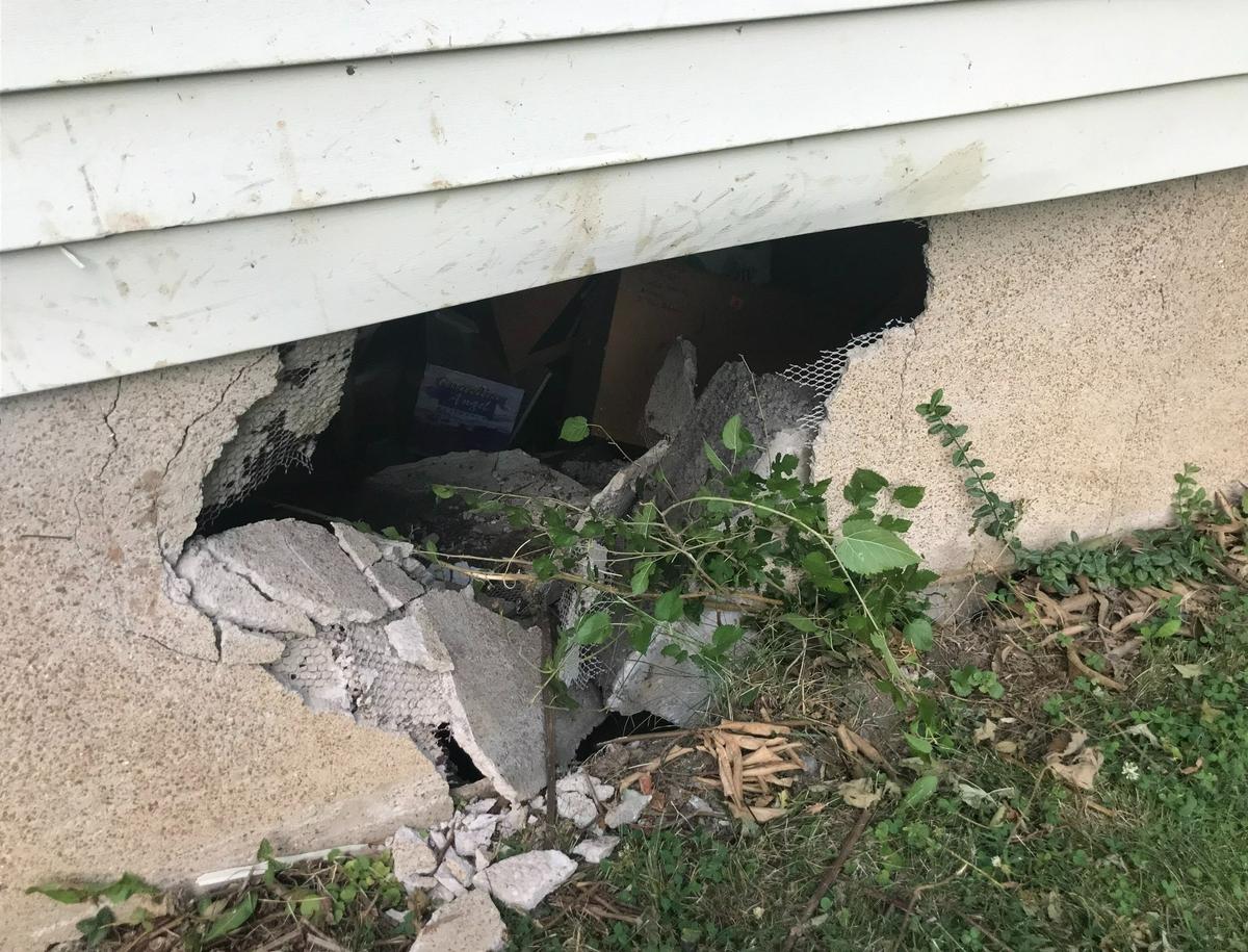 This hole in Fred Norton’s foundation was caused by a car that ran into his Belleville home on June 28 after missing a curve where South 17th Street runs into Belleville Crossing Street.