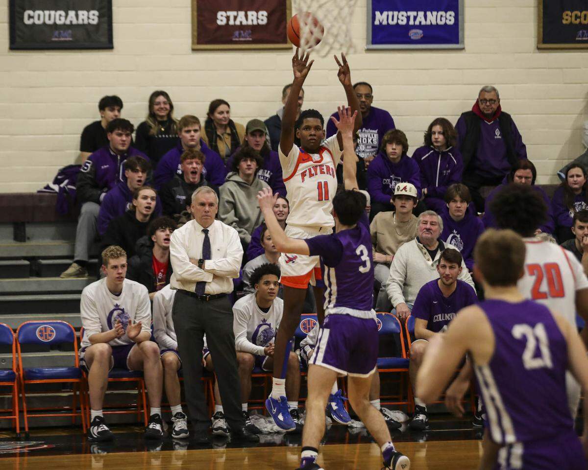 Davis Bynum of East St. Louis takes a 3-pointer during Friday night’s Southwestern Conference game against Collinsville. The Kahoks ultimately posted a 56-49 victory.