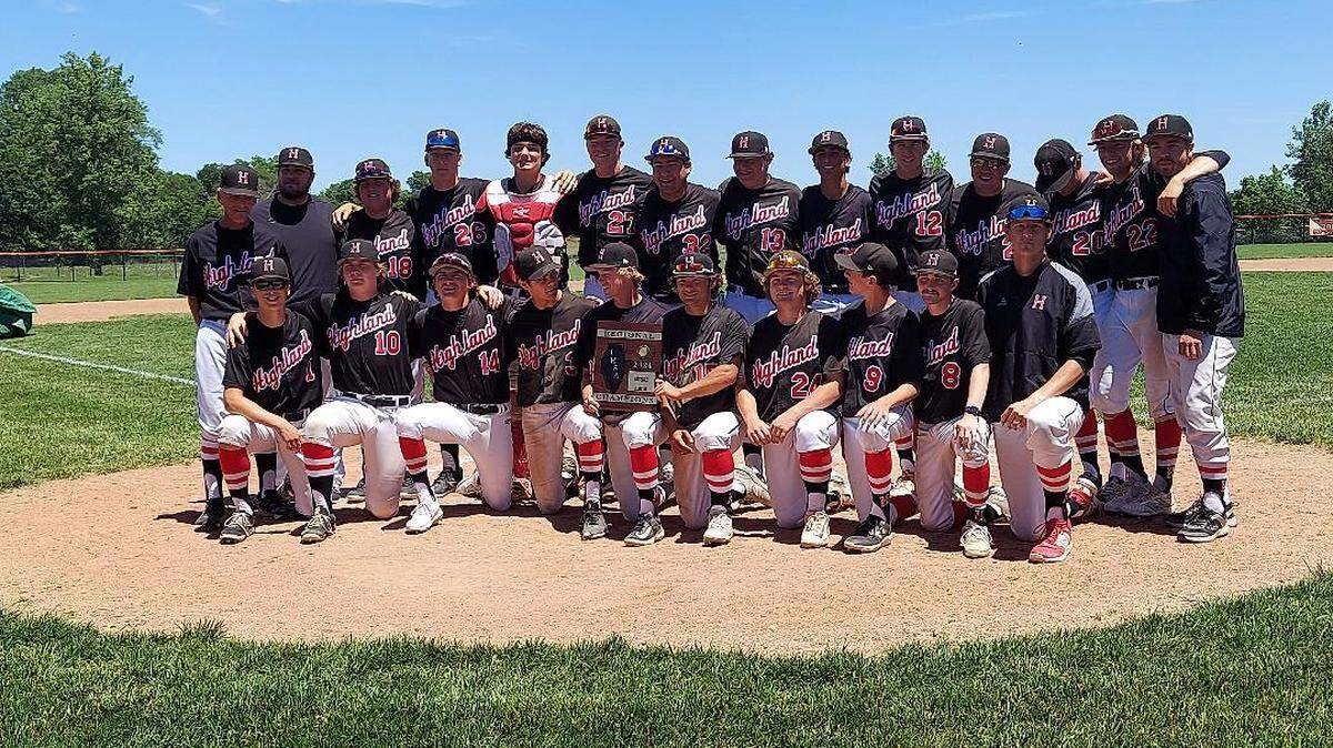 The Highland High School baseball team gathers after winning the IHSA regional Saturday.