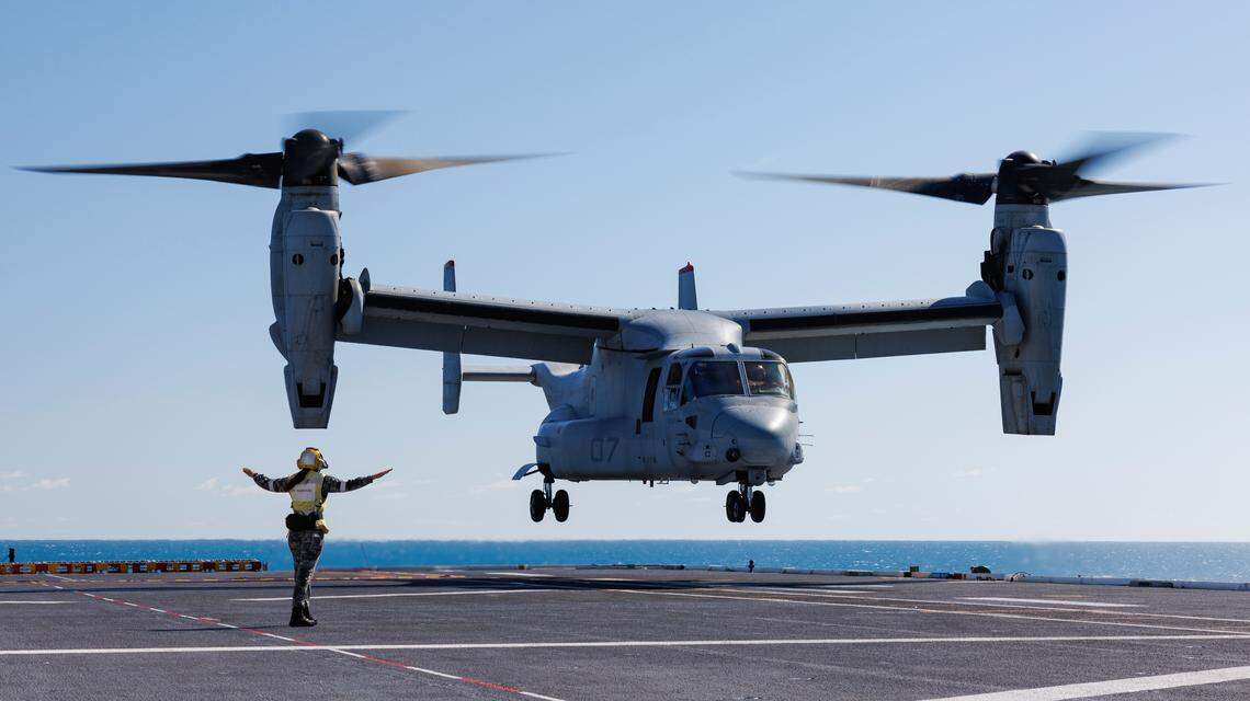 Royal Australian Navy sailor Leading Seaman Keely Hagedoorn guides a U.S. Marine Corps MV-22 Osprey during take-off and landing practice on the flight deck of HMAS Adelaide in the Whitsunday Islands off the coast of Australia during Exercise Sea Raider, Aug. 7, 2023. The Australian Defense Department said a Bell Boeing V-22 Osprey tiltrotor aircraft crashed on Melville Island, Sunday, Aug. 27, 2023 during Exercise Predators Run, which involves the militaries of the United States, Australia, Indonesia, the Philippines and East Timor. (SGT Andrew Sleeman/Royal Australian Navy via AP)