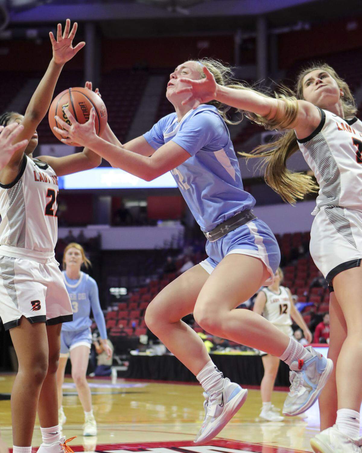 Mater Dei’s Amelia Beer hauls down a rebound during Saturday’s IHSA Class 2A state championship game at CEFCU Arena (formerly Redbird Arena) on the campus of Illinois State University. Mater Dei ultimately prevailed 62-46 to claim the state title.