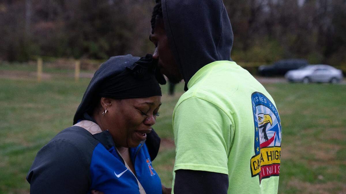 Mourners gather at the scene of an apparent murder-suicide in Cahokia Heights on Nov. 21, 2023.
