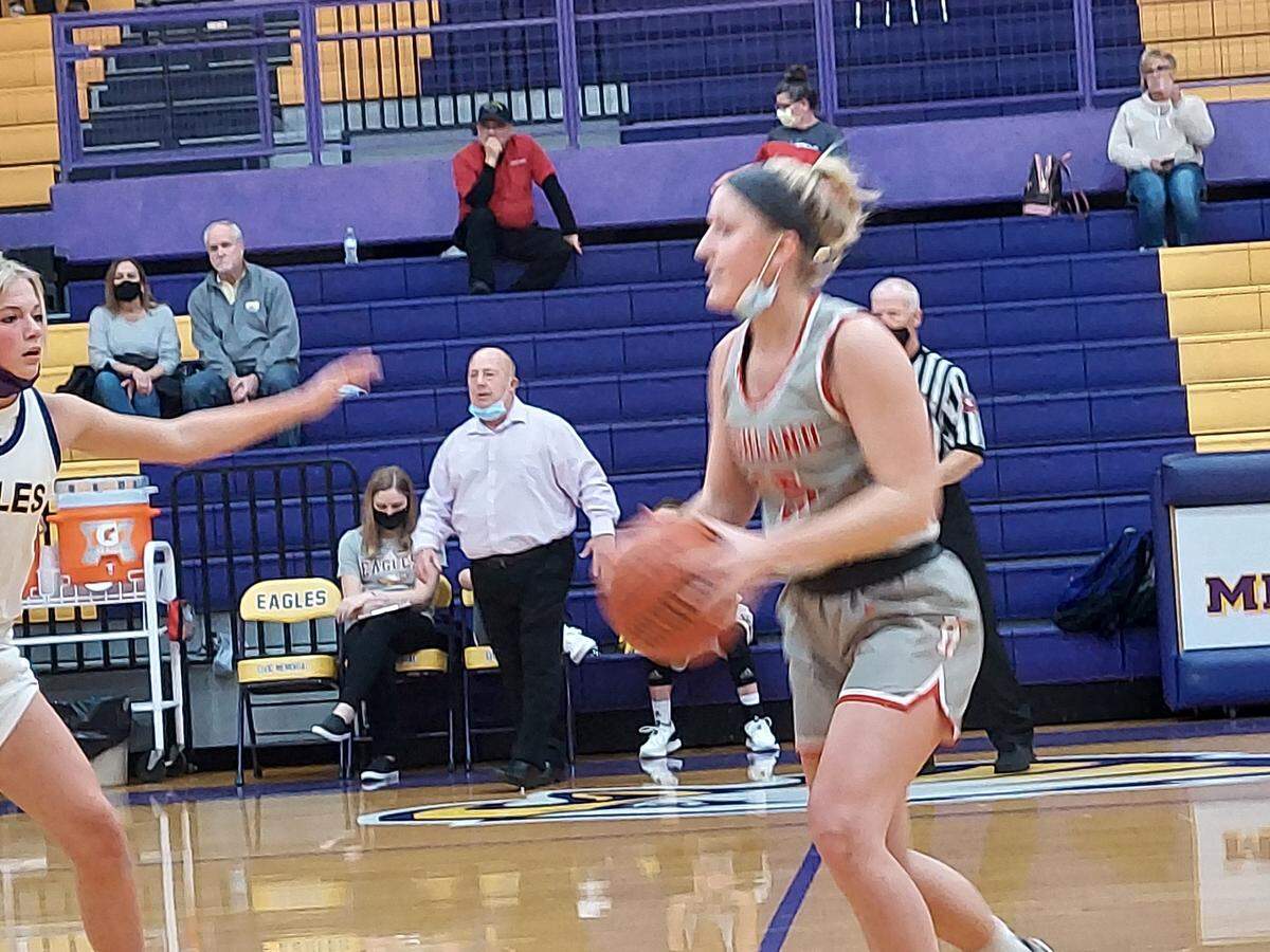 Highland’s Grace Wilke looks to drive to the basket against Civic Memorial’s Kelbie Zuppan during a Mississippi Valley Conference game Tuesday, Dec. 21, at Civic Memorial High School in Bethalto. The Lady Bulldogs fell to CM 50-35.