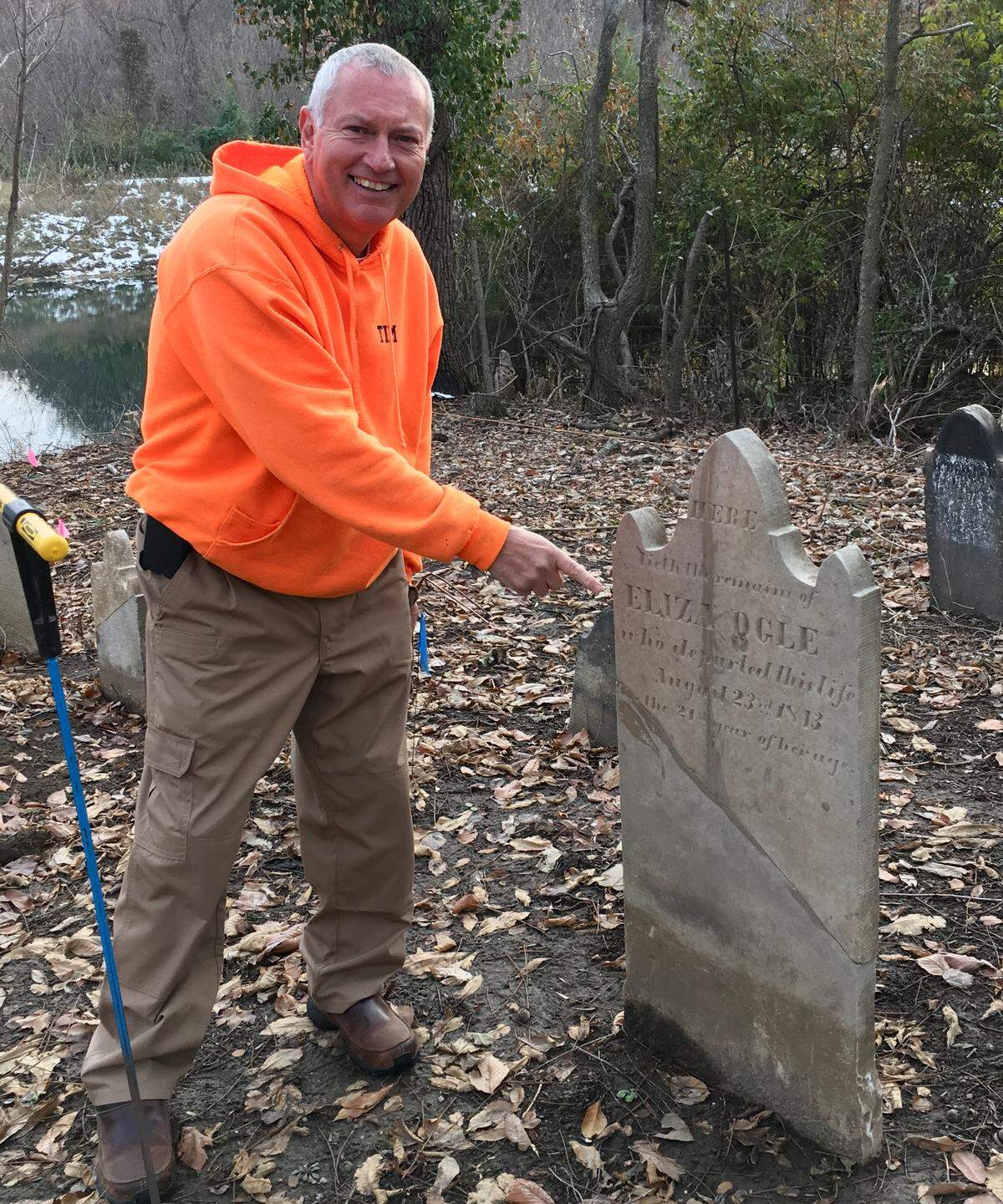 Tim Ogle at a relative’s gravesite. Ogle is a member of the Cemetery Detectives, a group who traverses St. Clair, Madison, Monroe and Randolph counties hunting for ancestral burial grounds and discovering local history on their excursions.