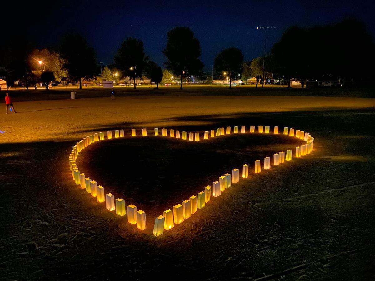 Luminaries form a heart pattern at a fundraising walk for the Swing for Sydney Foundation earlier this year, honoring the late Sydney Irizarry.