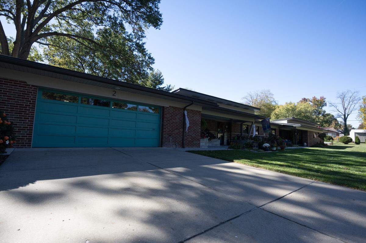 Outside a 1953 Frank Holtman house on Dahlia Dr. in. Belleville, currently owned and remodeled by owner Sharrol Toenies.