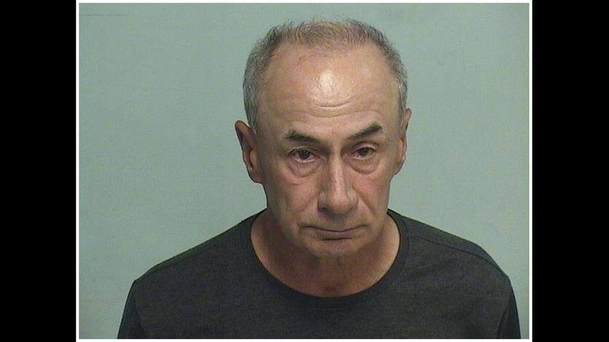 Joseph Zens, 67, is charged with a hate crime after chasing a motorcyclist with an icepick in Illinois, police say.