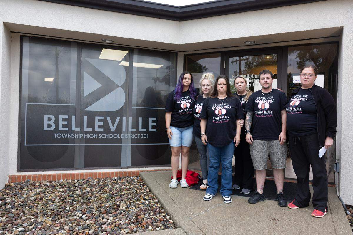 The family of Keagan Rex, who died in December, stands outside the Belleville District 201 building after providing a statement during public comment regarding a failure to acknowledge their late son during this year’s graduation ceremony.
