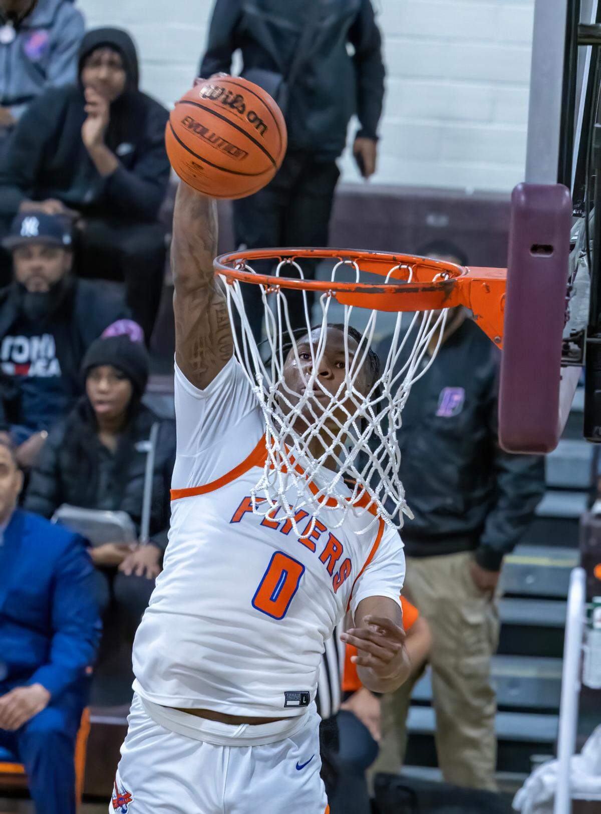 East St. Louis’ Macaleab Rich goes up for a dunk against Belleville West during Friday night’s Southwestern Conference game. The Flyers ultimately posted an 81-52 victory.