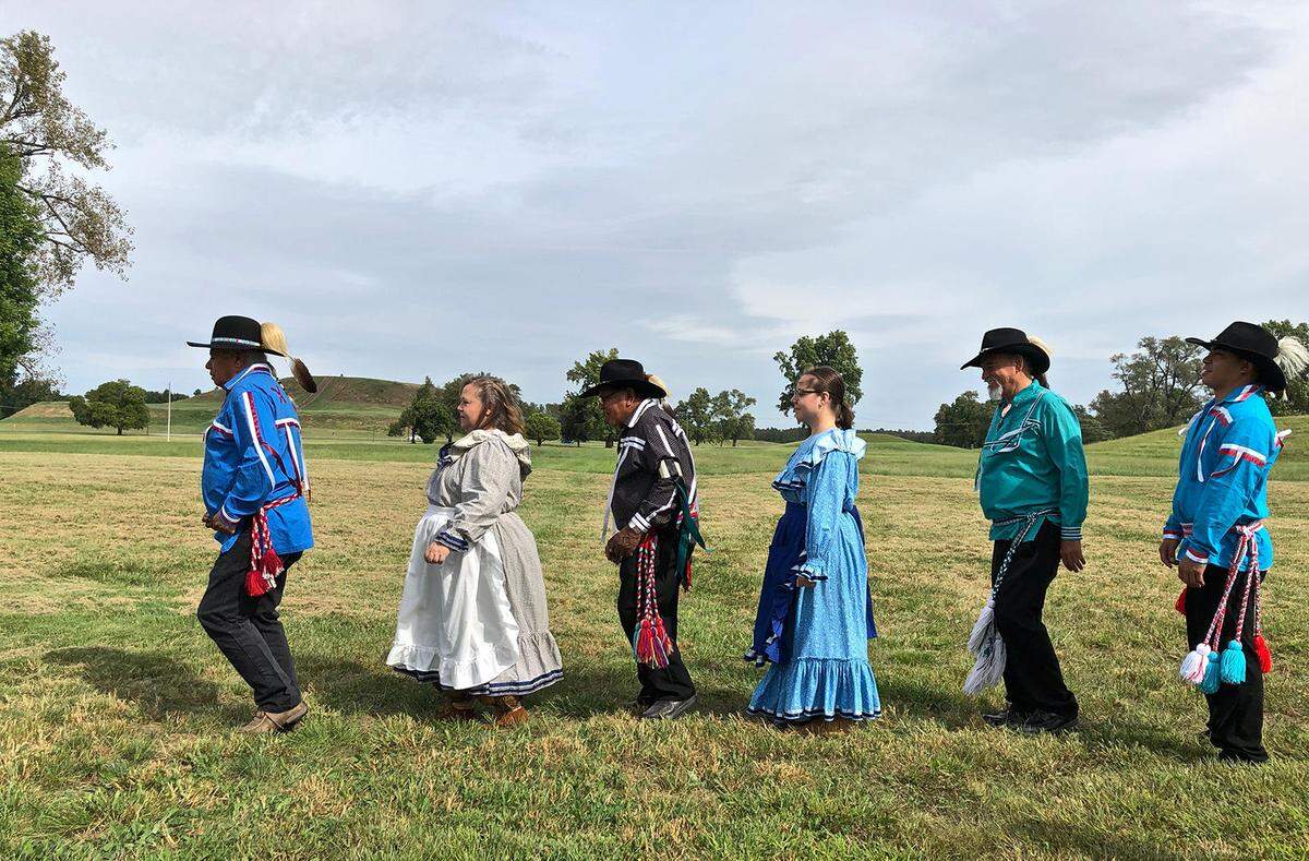 Members of the Chickasaw Nation Dance Troupe demonstrate stomp dance at Cahokia Mounds in Collinsville on Sept. 21. The tribe traces its ancestry to the ancient Mississippians who built the mounds 1,000 years ago.