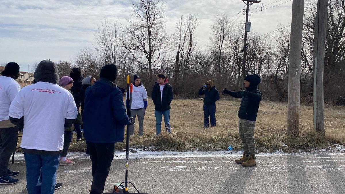 JD Dixon, an activist and organizer in the metro-east who created Empire 13, speaks to a group of volunteers who are participating in a cleanup in East St. Louis on Martin Luther King Jr. Day.