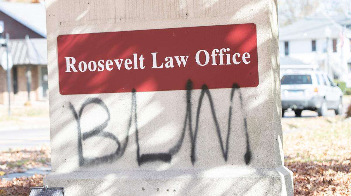 Police are looking for vandals who spray-painted “BLM” on buildings and signs, including this one for Roosevelt Law Office, in Edwardsville late Thursday or early Friday.