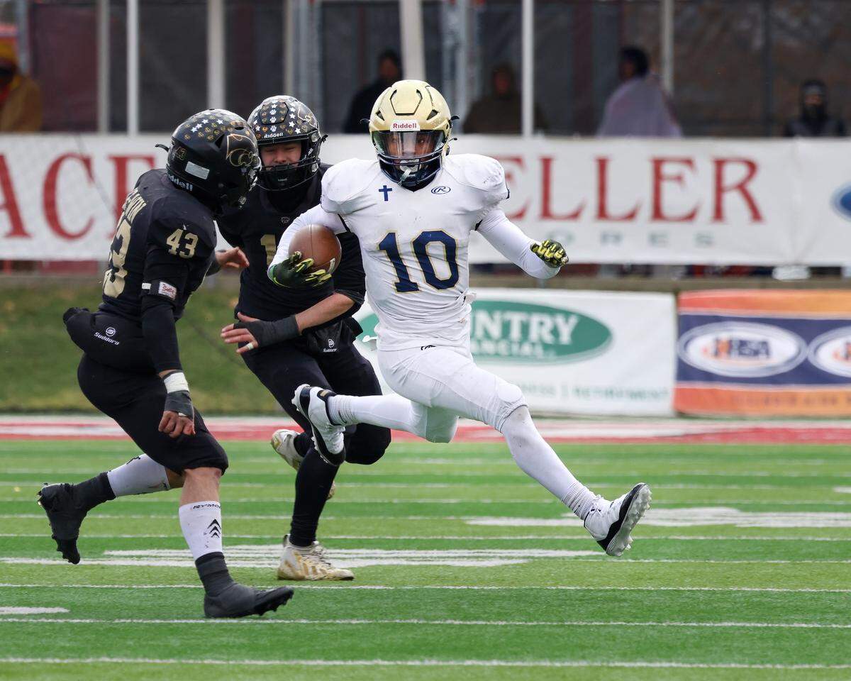 Althoff’s Dierre Hill Jr. carries the ball during the Crusaders’ 57-14 win over Lena-Winslow for the IHSA Class 1A title at Hancock Stadium on the campus of the Illinois State University.