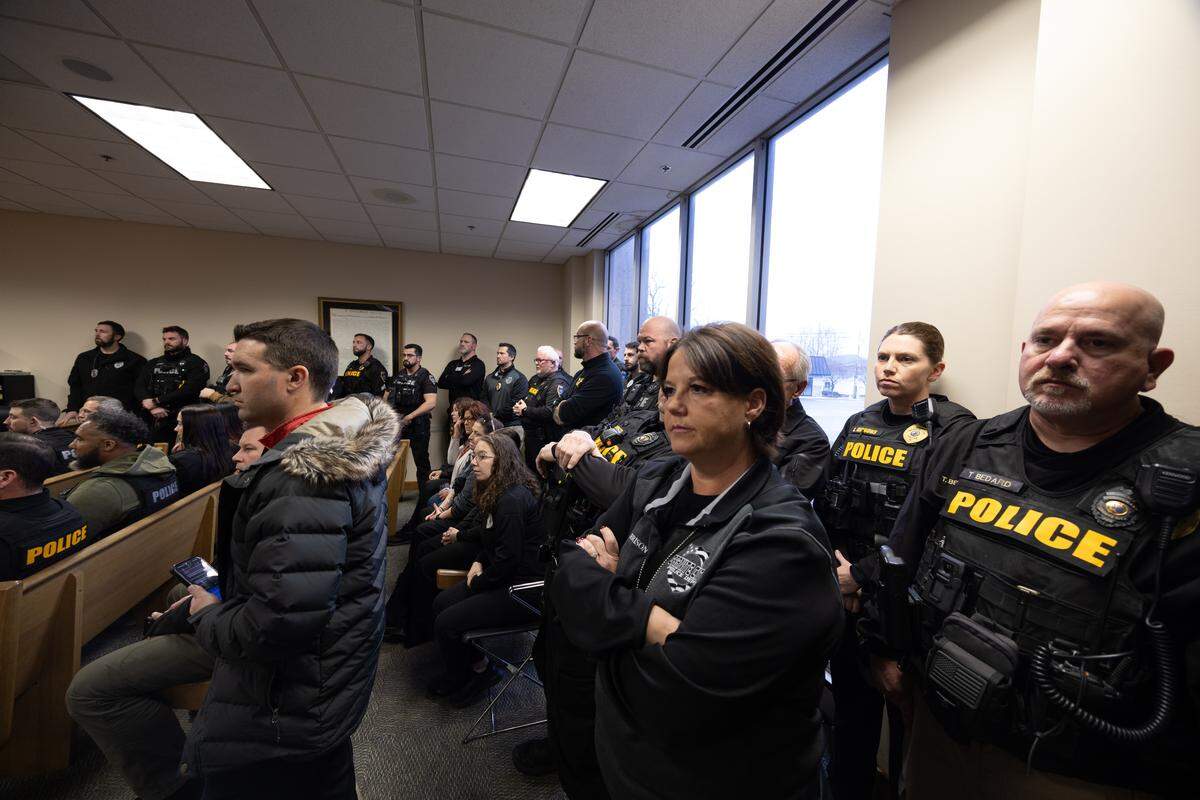 Dozens of police officers filled the courtroom during the scheduled pretrial detention hearing of DJ W. Marshall, 26, who is accused of shooting and injuring Granite City Police Officer Tyler Timmons.