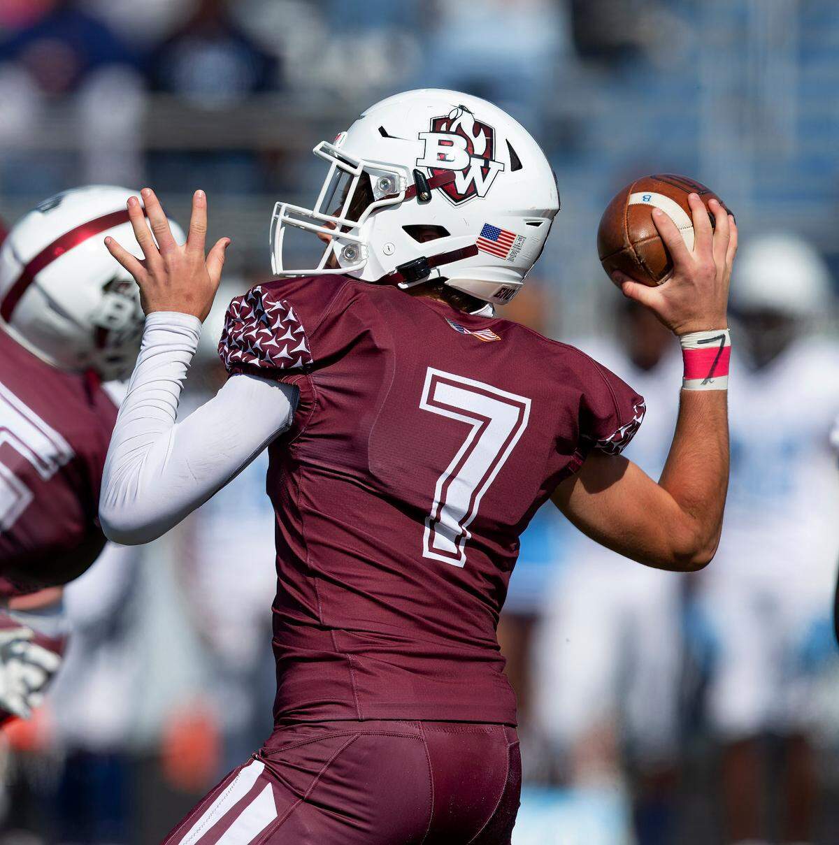 Belleville West quarterback Landon McDonald looks downfield for an open receiver during Saturday’s Southwestern Conference game against Belleville East. The Lancers ultimately prevailed 41-0.