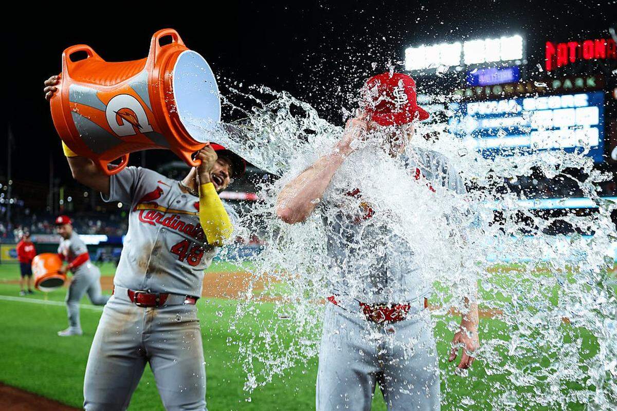 WASHINGTON, DC - MAY 09: Erick Fedde #12 of the St. Louis Cardinals is doused with water by IvÃ(degrees)n Herrera #48 after pitching a complete game shutout against the Washington Nationals at Nationals Park on May 9, 2025 in Washington, DC. (Photo by Scott Taetsch/Getty Images)