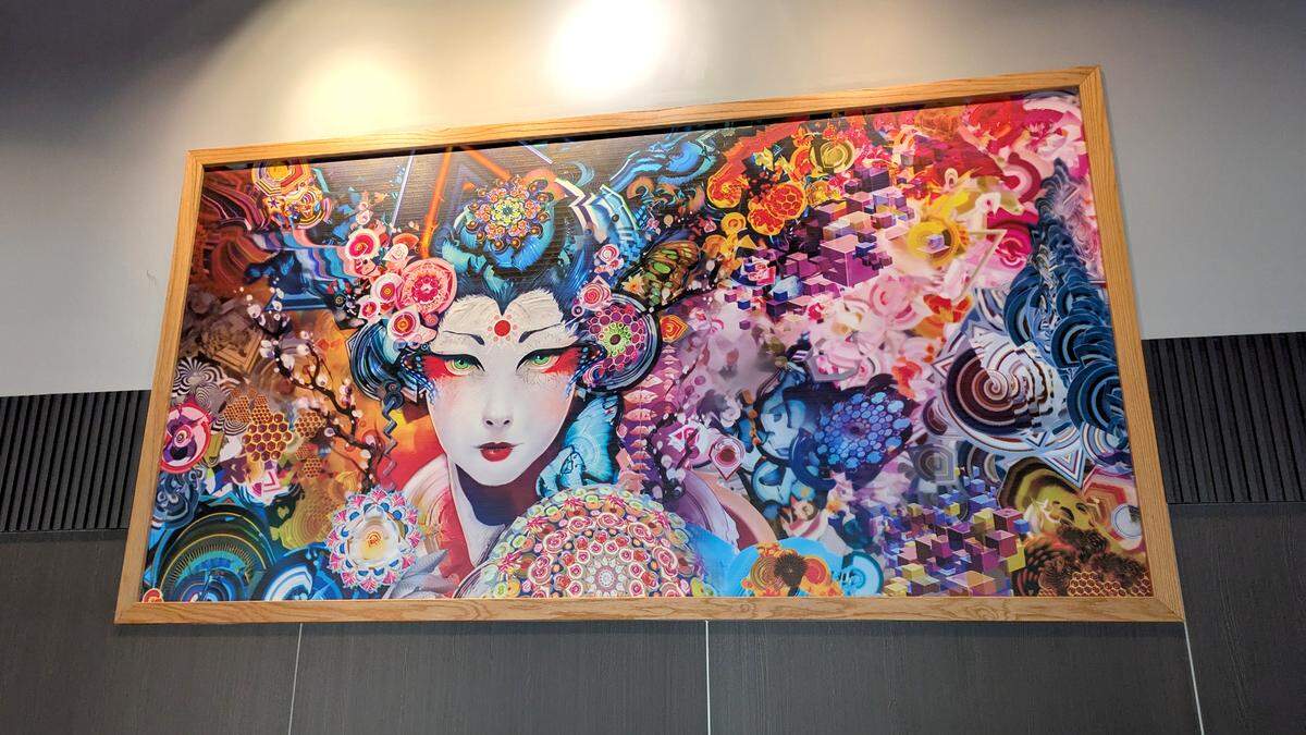 Vibrant artwork adorns the wall behind the sushi bar at Tasty Bowl in Fairview Heights.