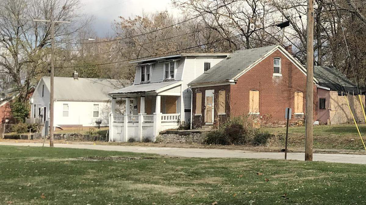 The city of Belleville is preparing to demolish 19 buildings, including a brick German American folk house at 214 N. 11th St., right, and the two-story frame home next to it at 218 N. 11th St. Both were built in the 1870s.