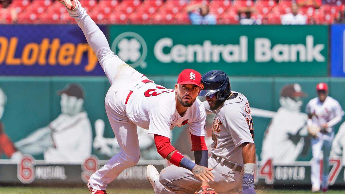 St. Louis Cardinals second baseman Edmundo Sosa, left, falls over Detroit Tigers’ Willi Castro while turning the double play during the fourth inning of a baseball game Wednesday, Aug. 25, 2021, in St. Louis. The Tigers’ Dustin Garneau was out at first. (AP Photo/Jeff Roberson)