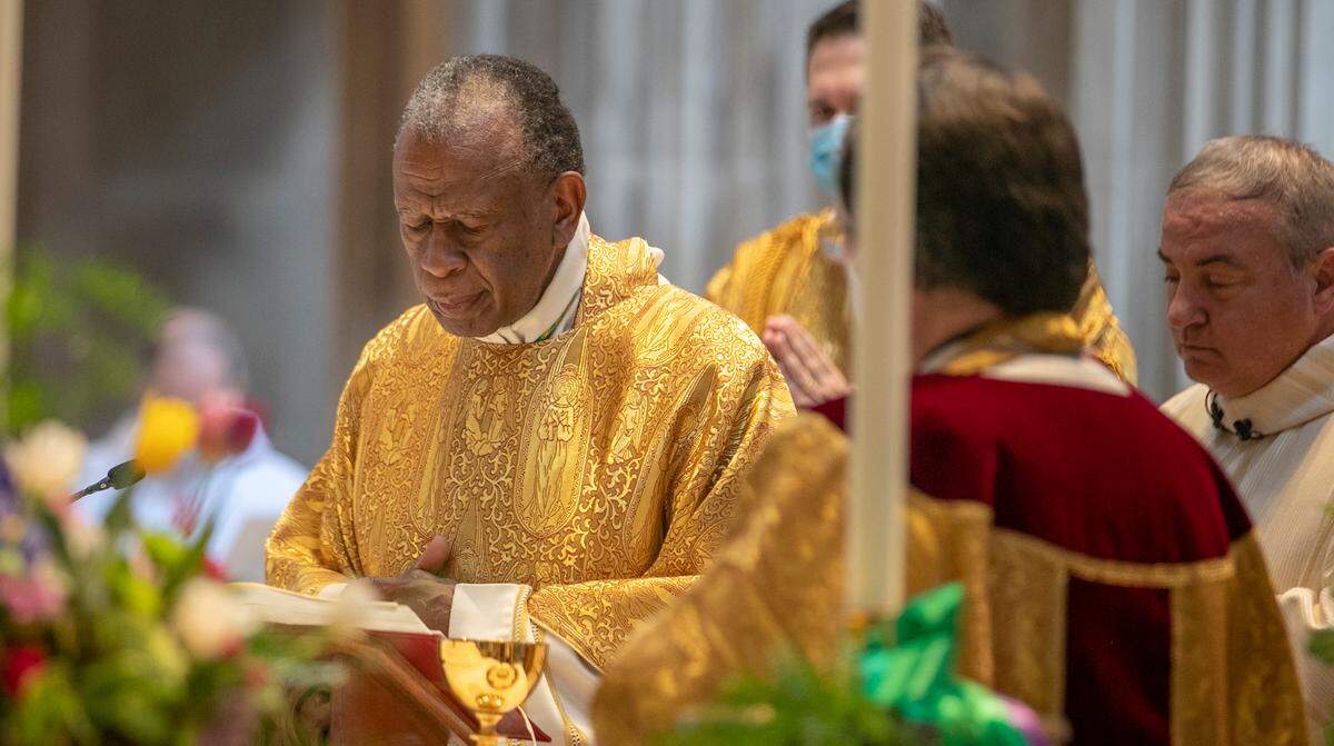 Bishop Emeritus Edward K. Braxton participates in the Liturgy of the Eucharist during a Mass of ordination and installation for new Bishop Michael G. McGovern on Wednesday at the Cathedral of St. Peter in Belleville.