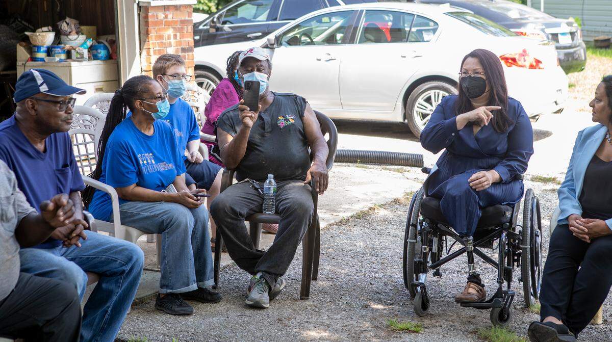 U.S. Senator Tammy Duckworth (D-IL) speaks with Cahokia Heights residents during a visit to a neighborhood that has persistent sewer and flooding issues. Sen. Duckworth was joined by state and federal representatives that will help oversee the funding and implementation of the future projects to help eliminate the sewer issues in the neighborhood.