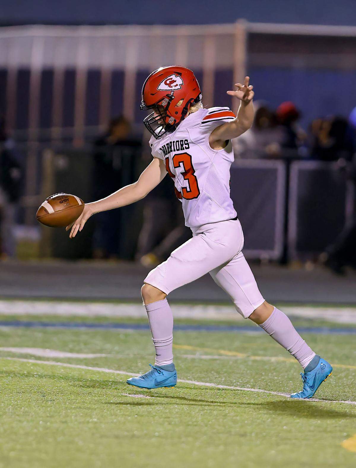 Granite City’s Brady Smallie punts the ball during Friday’s non-conference game against Belleville East. The Warriors ultimately lost to the Lancers.