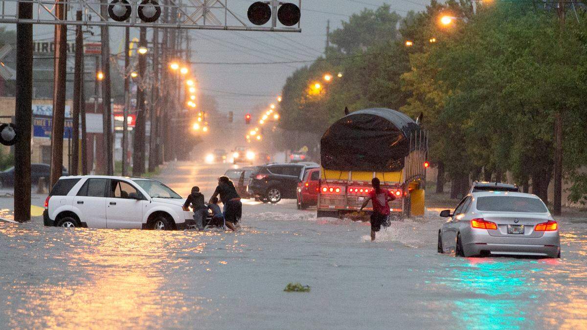 Several vehicles were stranded by the flash flooding on Madison Ave. in Granite City Thursday.
