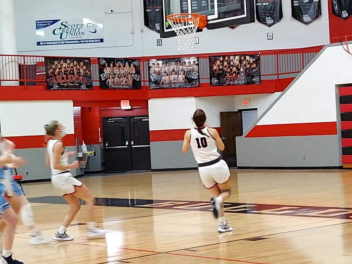 Highland’s Kirsten Taylor drives to the basket and scores against visiting Jerseyville in a Mississippi Valley Conference game during the 2020-21 season. Taylor has continued her outstanding hoops career at Lincoln Land Community College where she is playing point guard.