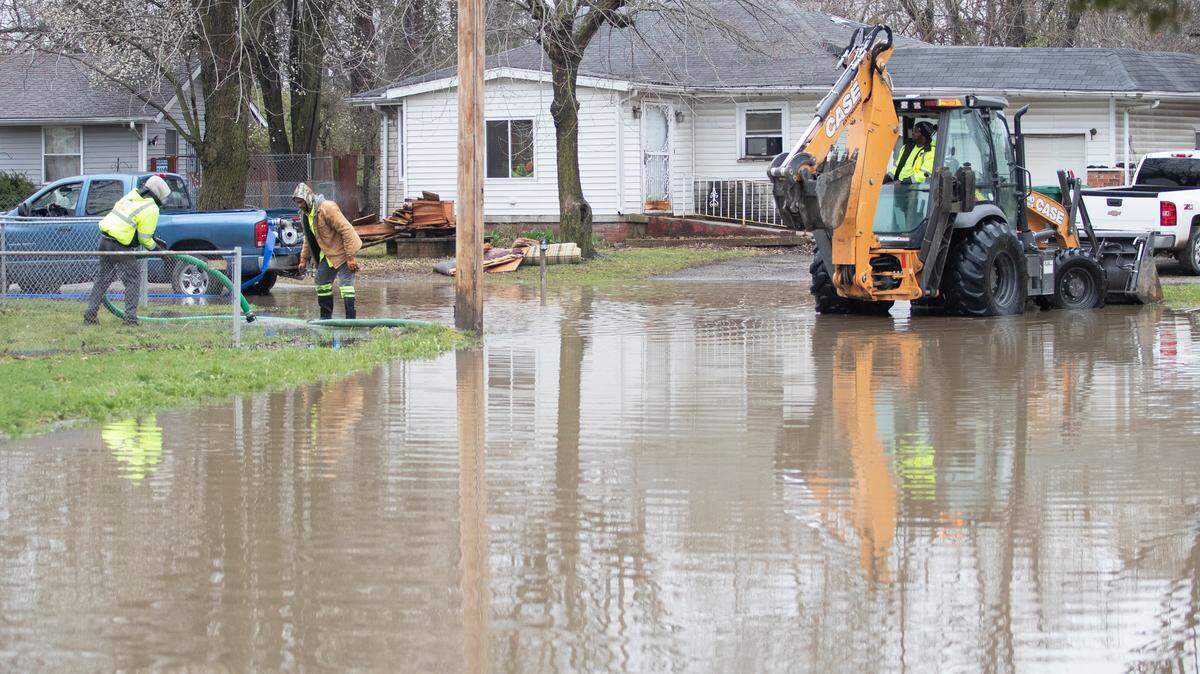 In this 2023 file photo, workers with the city of Cahokia Heights try to pump water out of the Piat Place neighborhood. Residents said the city was on the scene during the rain but were unable to keep up with the flooding.