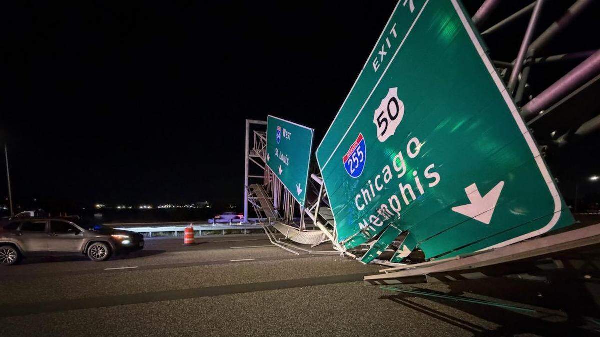 A highway sign on Interstate 64 near Interstate 255 collapsed after it was struck by a semi-truck late Wednesday. Traffic remained backed up seven miles on westbound I-64 into Fairview Heights Thursday morning.