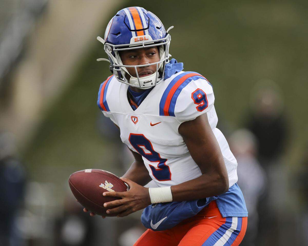 East St. Louis quarterback Robert Battle looks to make a play during the IHSA Class 6A state semifinals against Lemont. Battle and the Flyers posted a 32-29 victory and now will play in the state championship game at 1 p.m. Saturday, Nov. 26 at Memorial Stadium on the campus of the University of Illinois in Champaign.