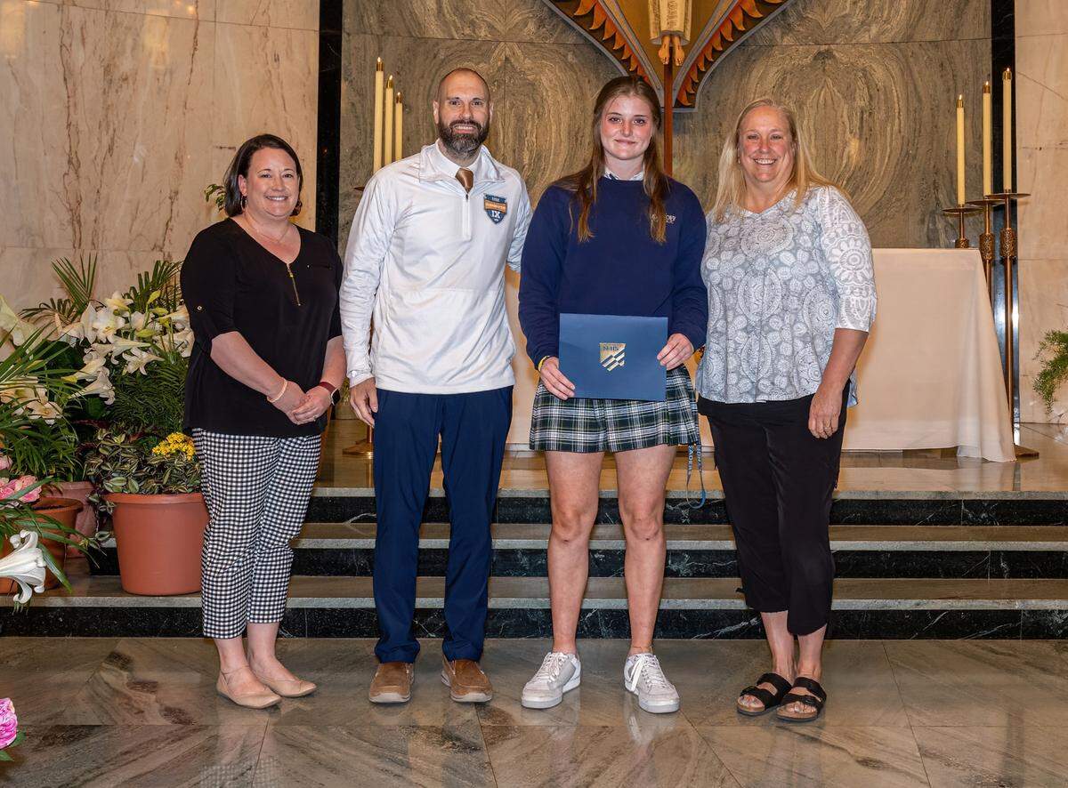 The Illinois High School Association has selected Althoff Catholic High School sophomore Gabby Orlet as its nominee for the 2022-23 National Federation of State High School Associations Sprit of Sport Award. From left, IHSA Assistant Executive Director Matt Troha, who presented the award to Orlet on Wednesday, April 12; Althoff Principal Sarah Gass; Orlet; and Althoff Athletic Director Kathy Wuller.